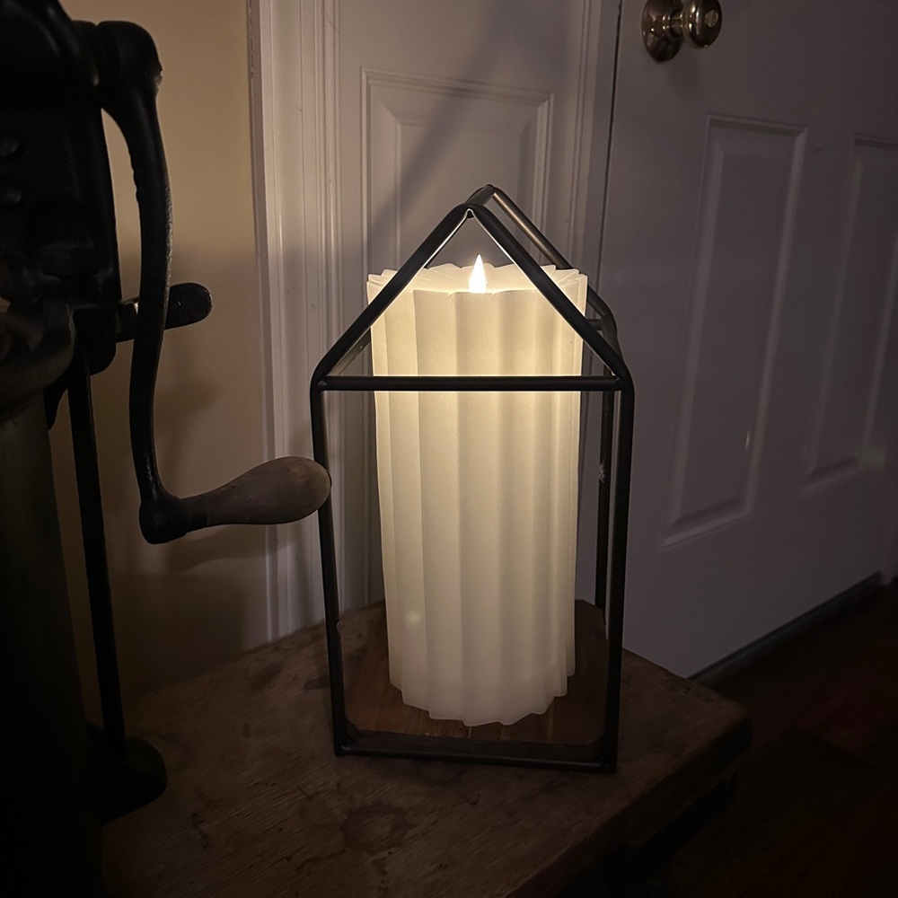 Wrought iron candle holder with wood base